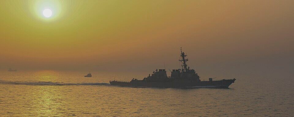 Strait of Hormuz near Larak Island as U.S. and regional forces monitor a tense maritime security situation.