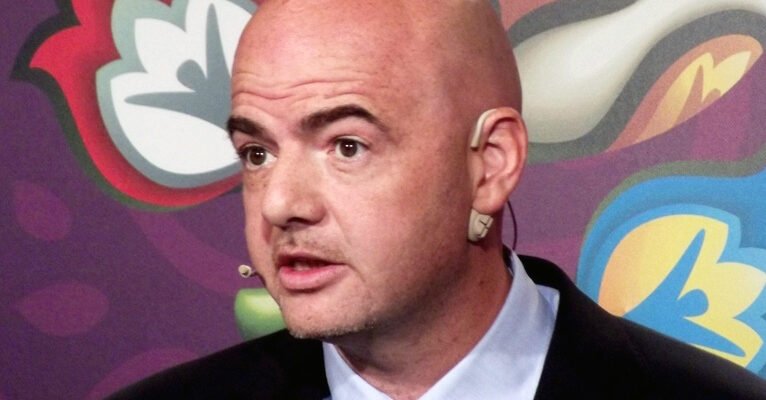 Gianni Infantino speaking to international soccer officials at a FIFA event