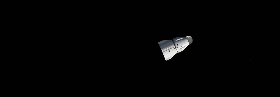 SpaceX Dragon spacecraft approaching the International Space Station above Earth