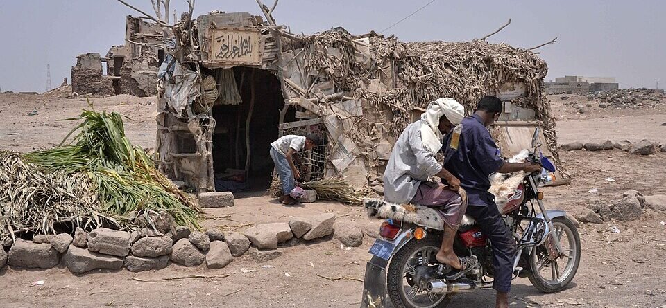 Humanitarian workers distributing food supplies amid access restrictions and worsening food insecurity in Taiz, Yemen.