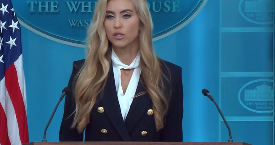 Katie Zacharia speaking at the White House podium during her first press briefing with reporters.