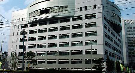 Japanese police investigating outside a hotel in Naha, Okinawa, following the arrest of a U.S. Marine.