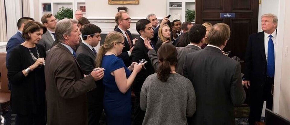President Donald Trump speaking with reporters during a tense White House press gaggle while discussing Russia sanctions, hostage negotiations, and foreign policy.